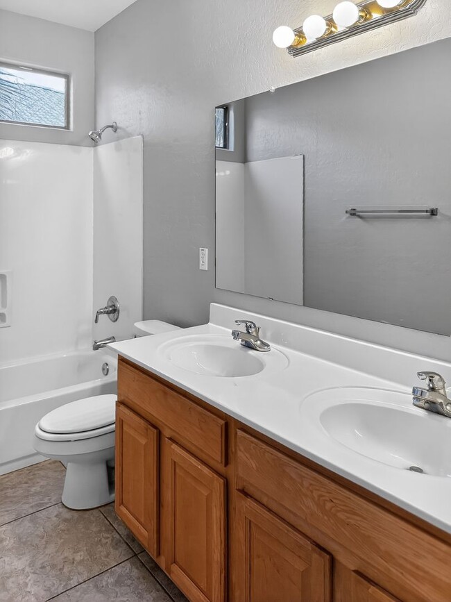 Building Photo - Single-level 4 bed, 2 bath home with tandem 3-car garage and RV gate.