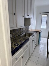 Origianl tile in kitchen - 232 N Clark Dr