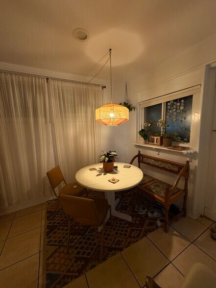 Dining area right next to kitchen and located next to window and front door for fresh air and sun!! - 125 26th St