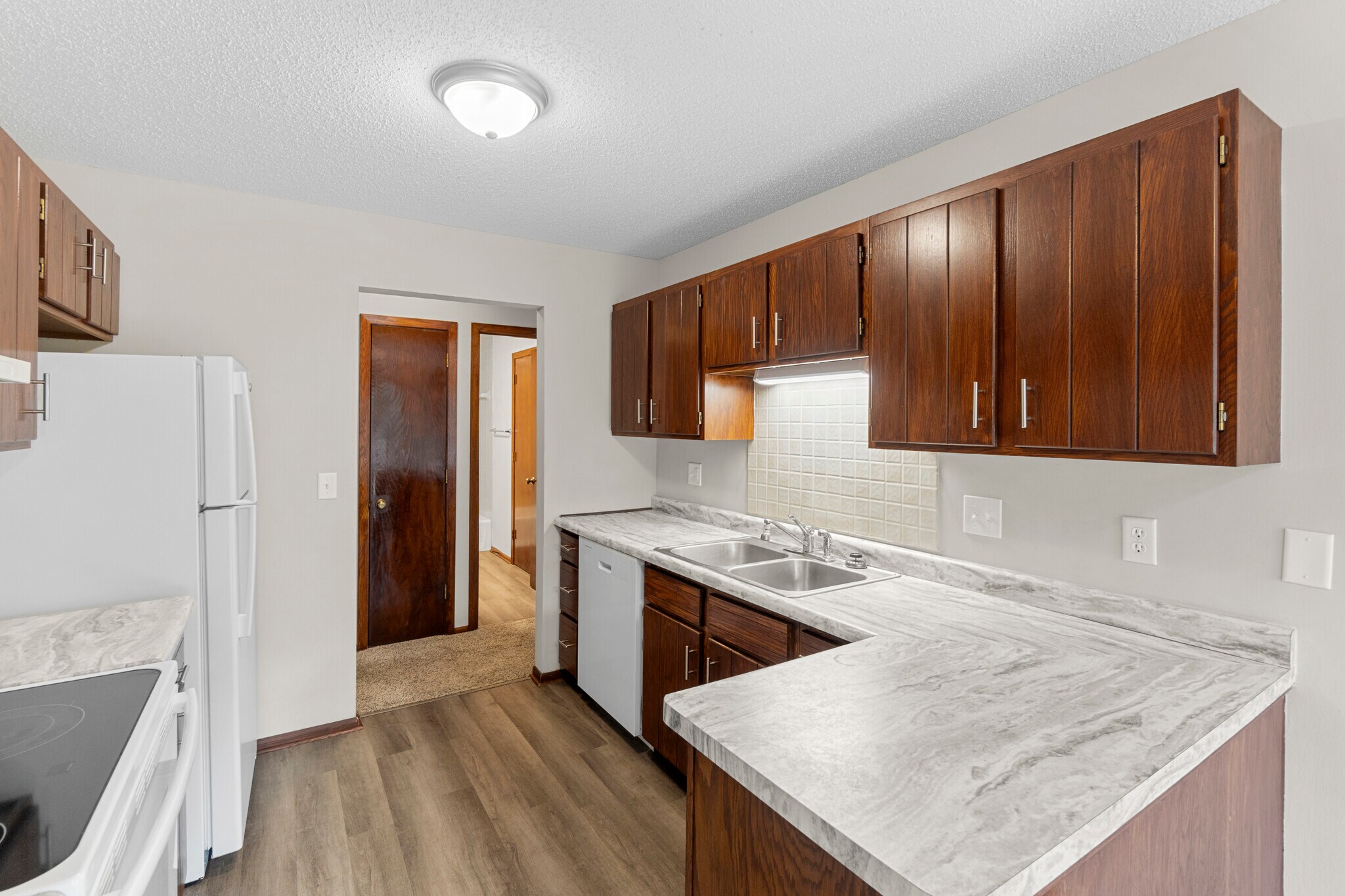 New countertops, plenty of cabinet space, dishwasher, newer appliances, new fixtures - 9774 Dorset Ln