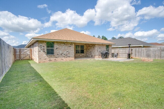 Building Photo - Spacious 4BR/2BA Brick Home with 2-Car Garage, Granite Kitchen, Vaulted Ceilings & Fully Fenced B...
