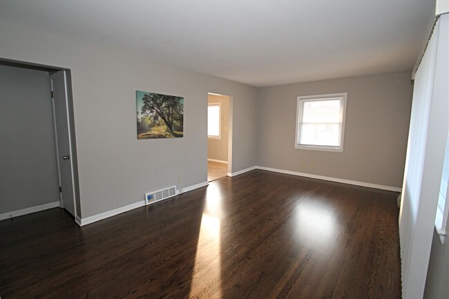 Living Room with Gleaming Hardwood Floors - 2670 N 116th St