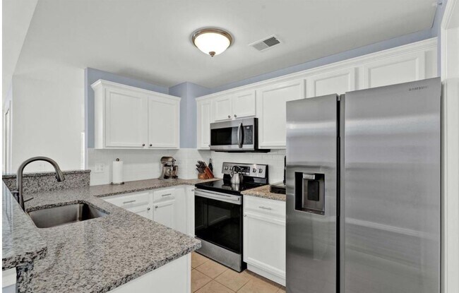 Building Photo - 7869 Ambassador Dr