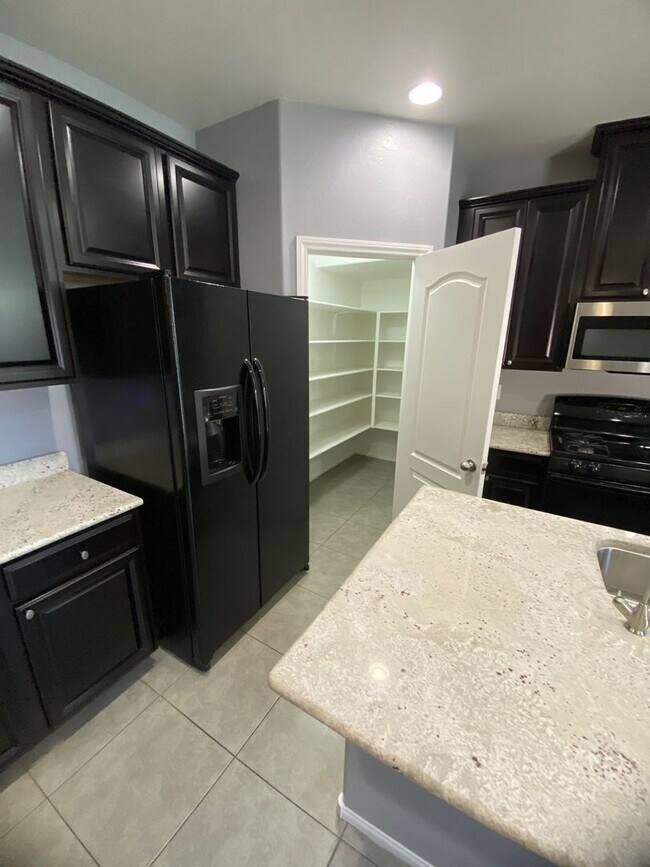Building Photo - AMERICANA Property Mgmt - Beautiful 4 beds...