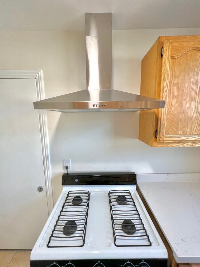 Gas Range and Stainless range hood - 2459 Torrance Blvd