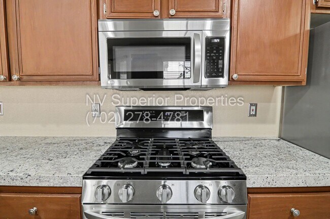 Building Photo - NW!! 4 bedrooms!! Bed & Bath DownStairs!!! RV Parking!!! Synthetic Grass Front yard!! Real Grass ...