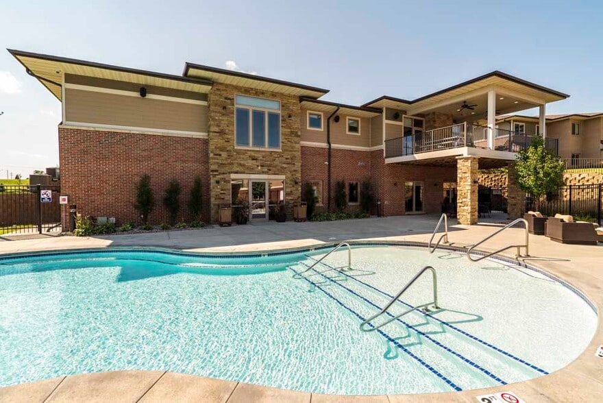 Hot days call for cool swims in our resort-style swimming pool. - Villas of Omaha at Butler Ridge