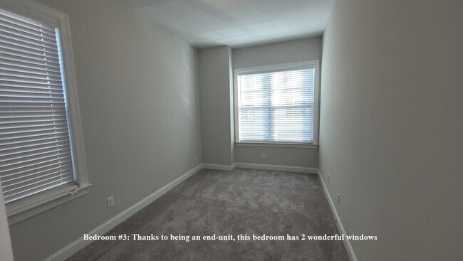 Building Photo - End-unit townhome with plenty of extra windows! Gated Community.