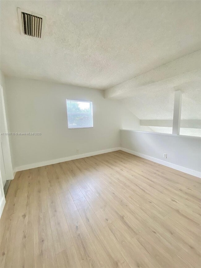 Building Photo - 3200 Coral Springs Dr
