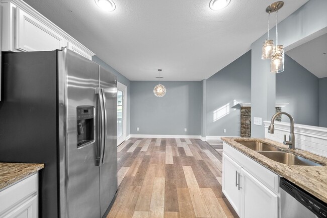 Building Photo - Pet Friendly Three Bedroom with Bonus!