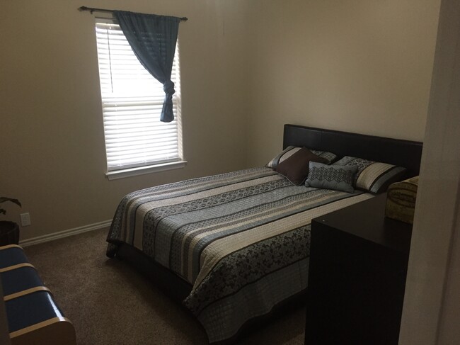 One bedroom opposite side of house from master - 500 Longhorn Dr