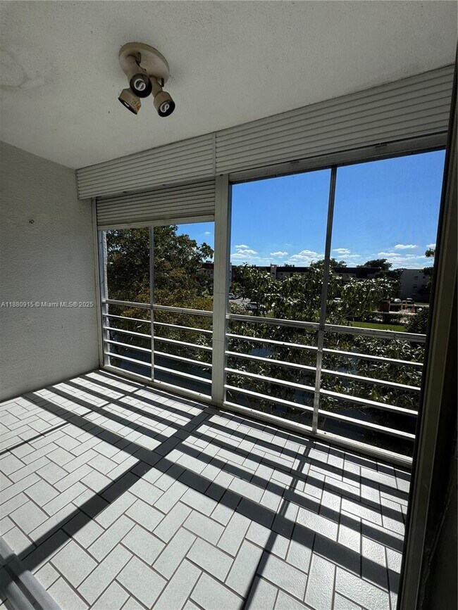 Building Photo - 8595 Sunrise Lakes Blvd