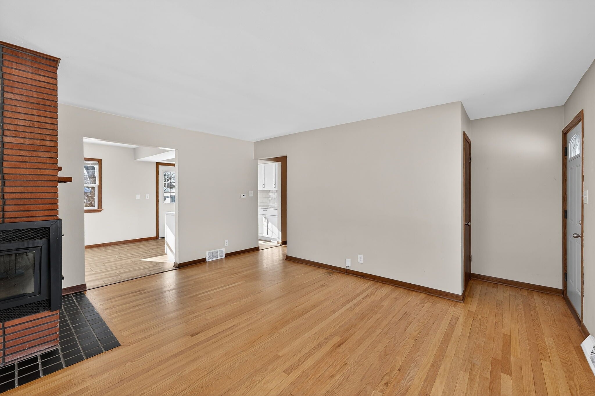 Living room - open floor plan to dining area - 10525 W Custer Ave