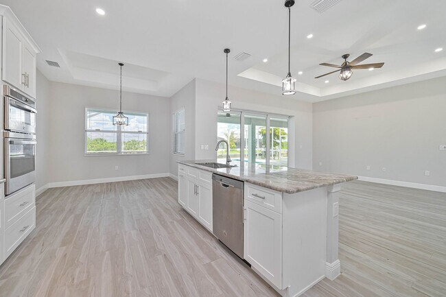 Building Photo - NOW AVAILABLE - Gorgeous Pool Home ~ NW Cape ~ 3 Car Garage ~ On Canal!