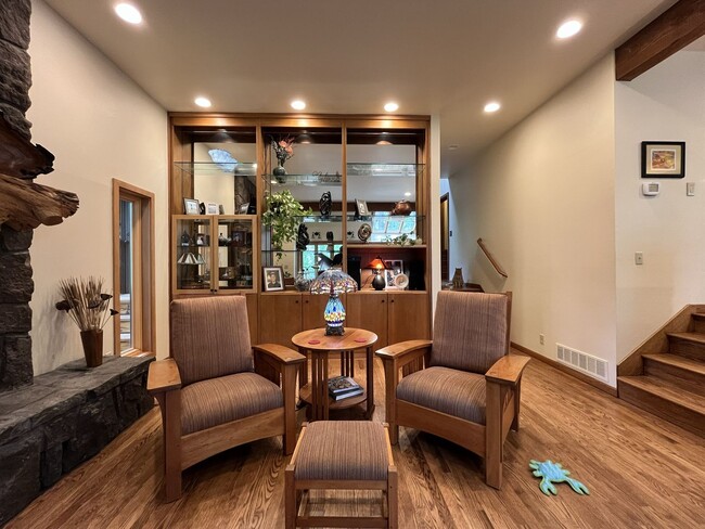 Building Photo - One-of-a-Kind Custom Home with Wall of Windows, Stone Fireplaces, Expansive Entertainment Space &...