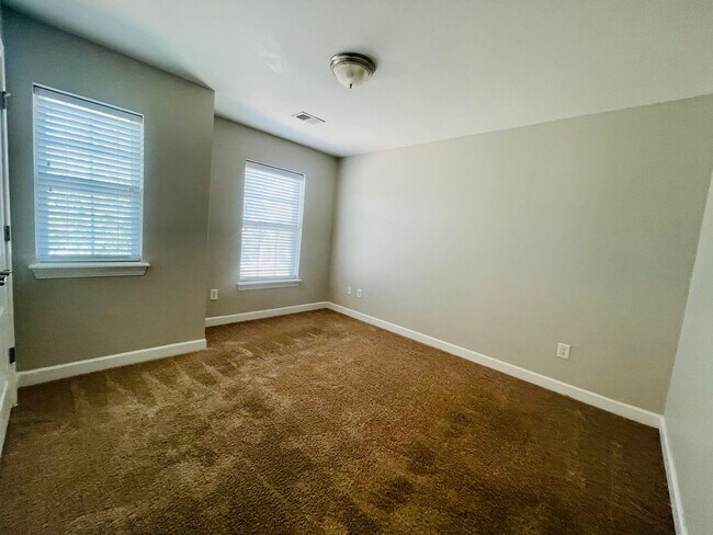 Building Photo - BRAND NEW FLOORING & FRESH PAINT - 3 Bedroom/2.5 Bath Townhome with garage in Wild Wing!