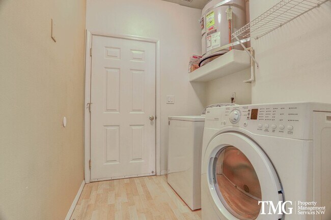 Building Photo - Spacious Ground-Level 2BD Condo with Garage & Resort-Style Amenities