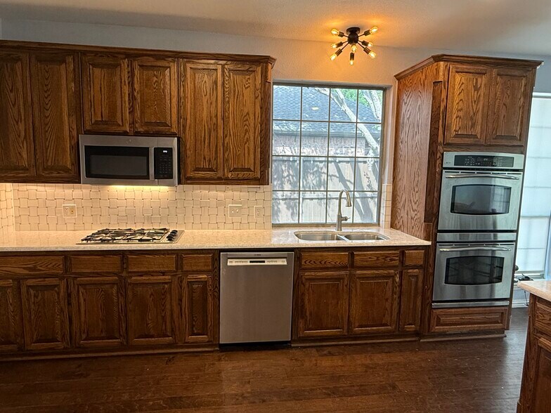 Kitchen - Double oven, microwave, range and Bosch dishwasher. - 2489 Yuma Dr