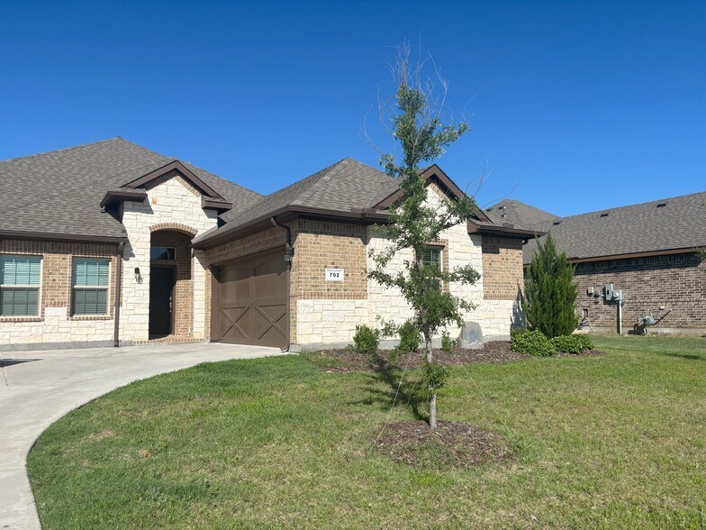 Front of Home - Brick Exterior and Car Garage - 702 Audrey Ln