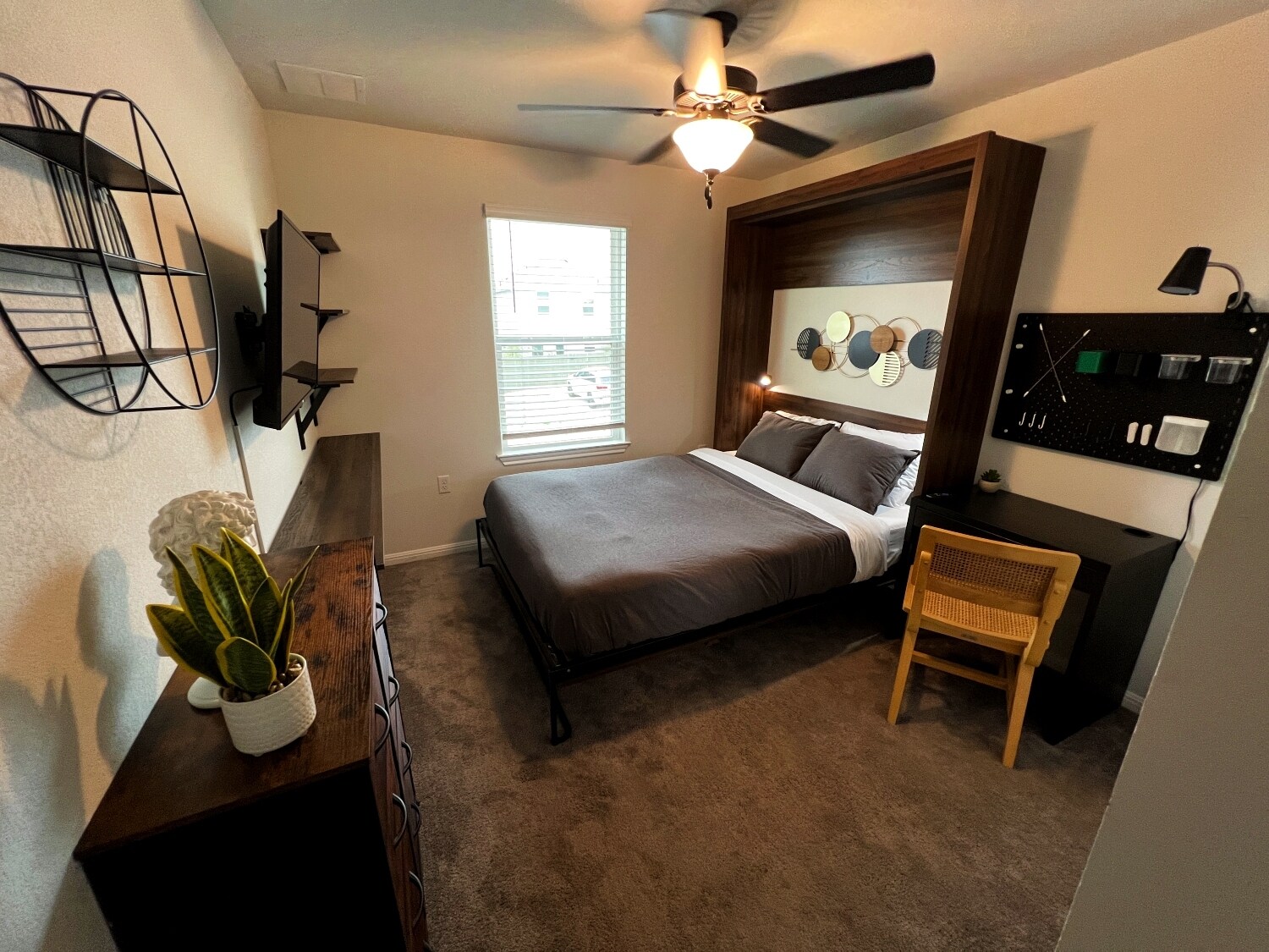 Guest bedroom #2 - Queen murphy bed, smart tv, and desk space. - 9611 Morning Iris Dr