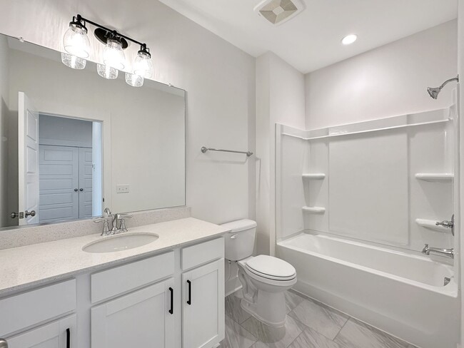 Building Photo - Beautiful, 3-Bedroom Midtown Nexton Townhome with Garage & Amenities