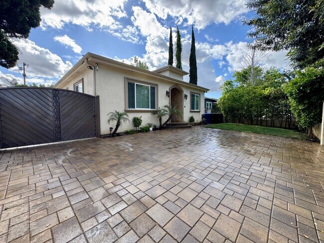 Building Photo - Peaceful North Hollywood street, charming three-bedroom, three-bathroom residence