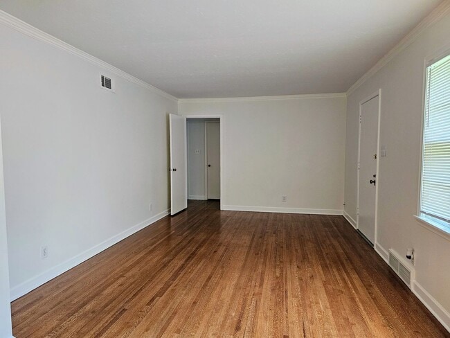 Building Photo - Brick Ranch Charmer with Hardwoods, In-Unit Laundry & Fenced Yard — Available Now!