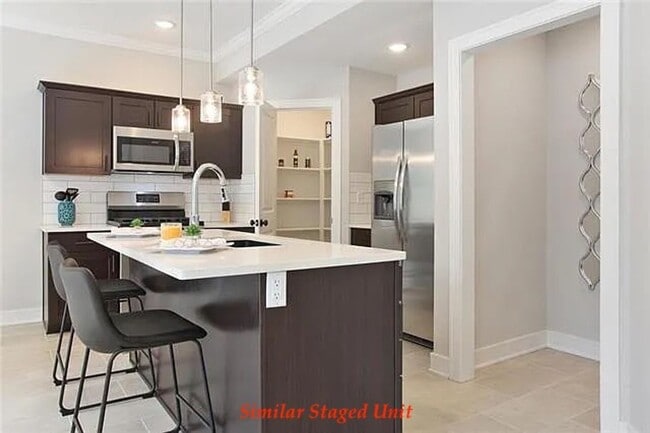 Building Photo - Stunning and Bright 3BR 2.5BA Townhome w/ 2-Car Garage • Quartzite Kitchen • Deck in Parkville