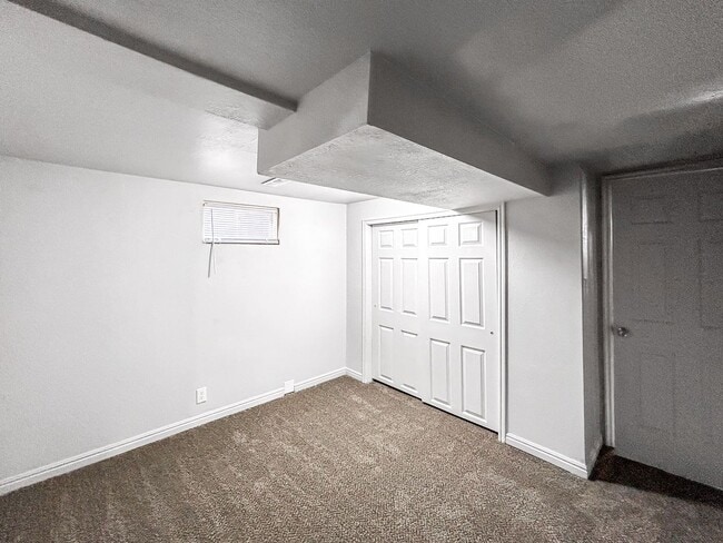 Building Photo - Spacious 5-Bedroom Home with Lofted Garage