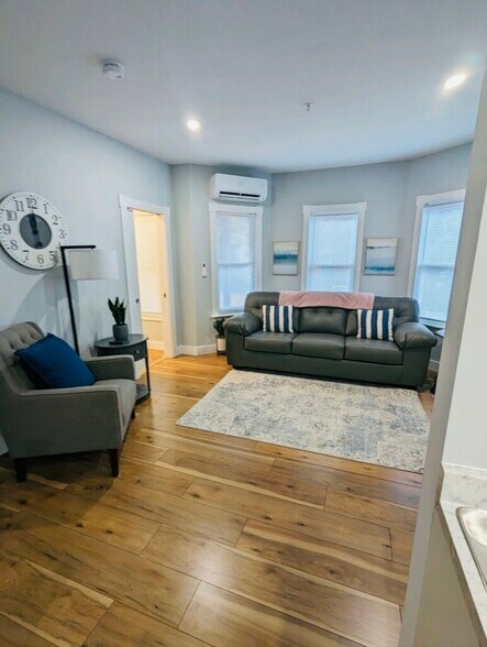 Bright and comfortable living room with high-efficiency heating and cooling - 188 S Champlain St