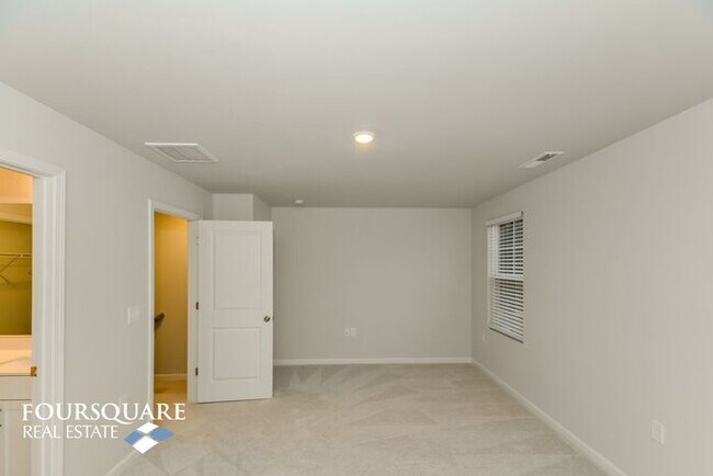 Building Photo - Modern 3-Story Townhome with First-Level B...