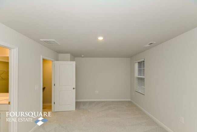 Building Photo - Modern 3-Story Townhome with First-Level Bedroom, Open Floor Plan & Community Pool – Prime RTP Lo...