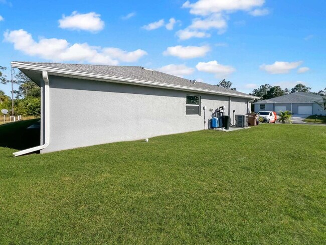 Building Photo - Move-In Special! Half Month FREE – APPLY by November 30th – Modern 3BR/2BA Duplex in Lehigh Acres...