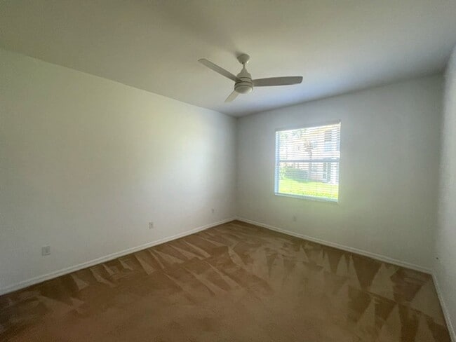 Building Photo - Elegant 3 Bedroom End-Unit Condo with Screened Lanai & Pond Views and A Private Garage