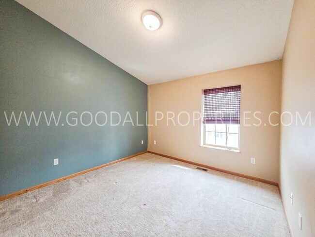 Building Photo - Bright & Spacious Waukee Townhome Near Dining, Shopping & Entertainment and attached 2-car garage