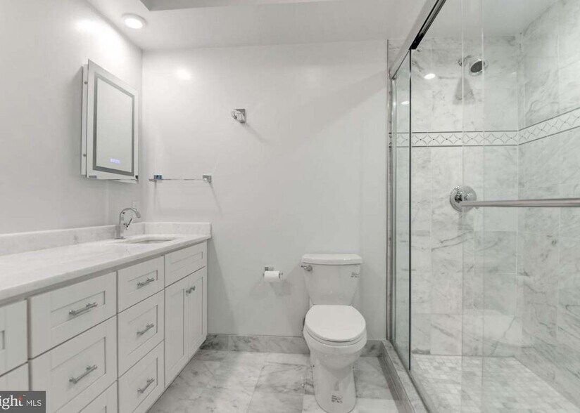 White Marble Ensuite Bath w a large Walk In shower - 4600 Kenmore Dr NW