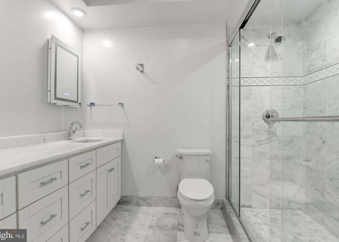 White Marble Ensuite Bath w a large Walk In shower - 4600 Kenmore Dr NW