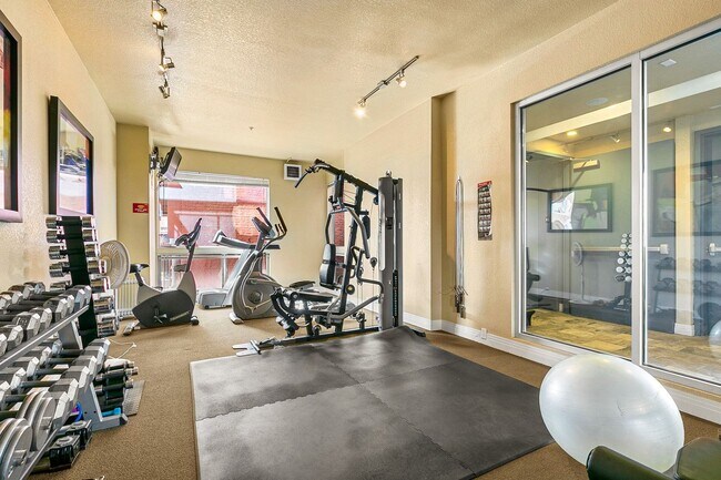 Building Photo - Fantastic Condo With Central AC And 1 Reserved Garage Parking Space!