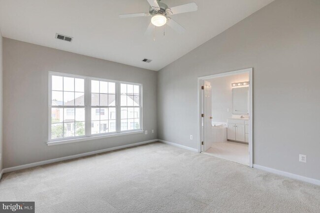 Building Photo - Spacious 3-level townhome with a 2-car garage in the desirable South Riding community.