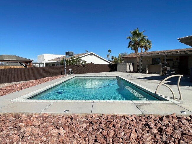 Building Photo - OWNER'S SUMMER SPECIAL-$300 OFF first 3 months! Sparkling Pool Home!