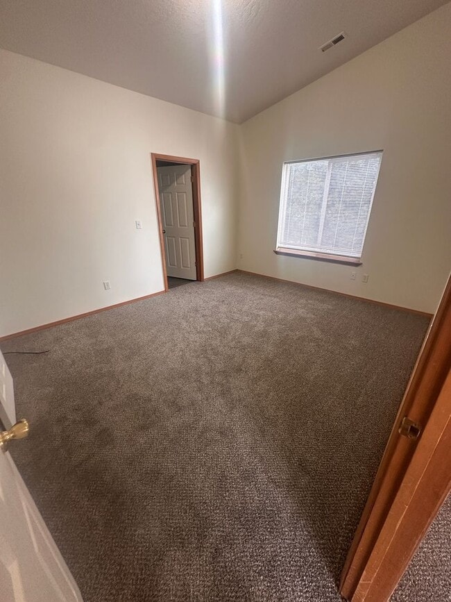 Building Photo - Newer Carpet, flooring & paint! 3 Bedroom 2 Bath with 2 car attached garage.