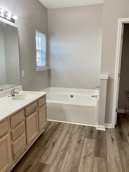 Master bathroom with dual vanity, private shower, jetted garden tub, and private water closet! - 1914 Conifer Cir