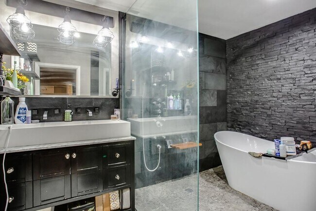 Building Photo - Spacious 4-Bedroom Home with Dual Living Areas