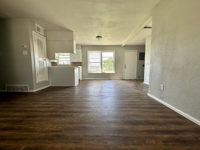 Building Photo - Updated Home with Gorgeous Floors & Large Backyard