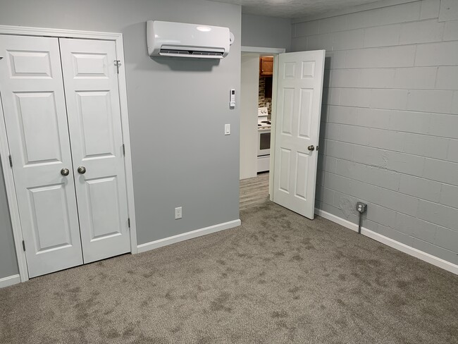 bedroom with double door closet - 705 Peach Tree Ln