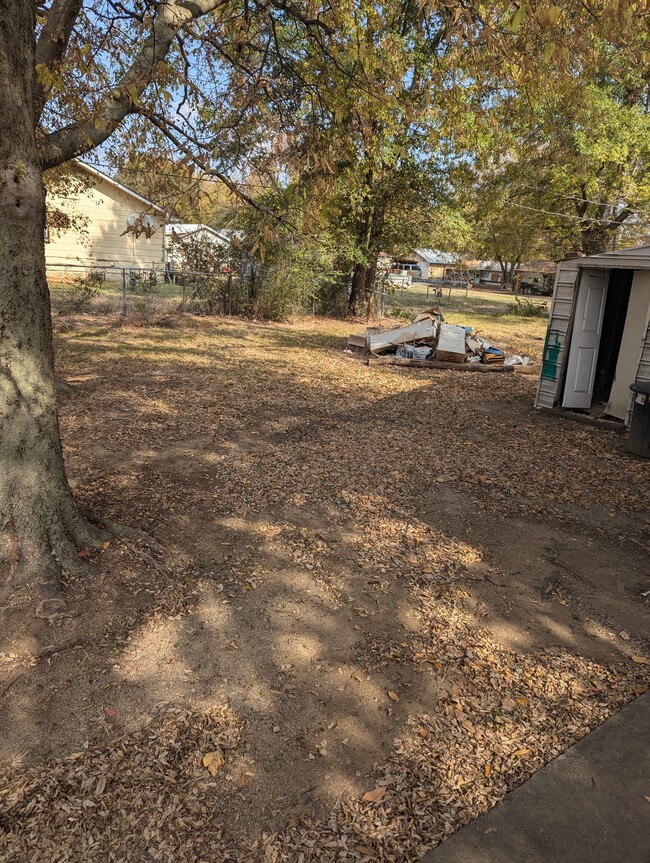 Side yard, trash pile and shed will be removed - 509 S Wilson St