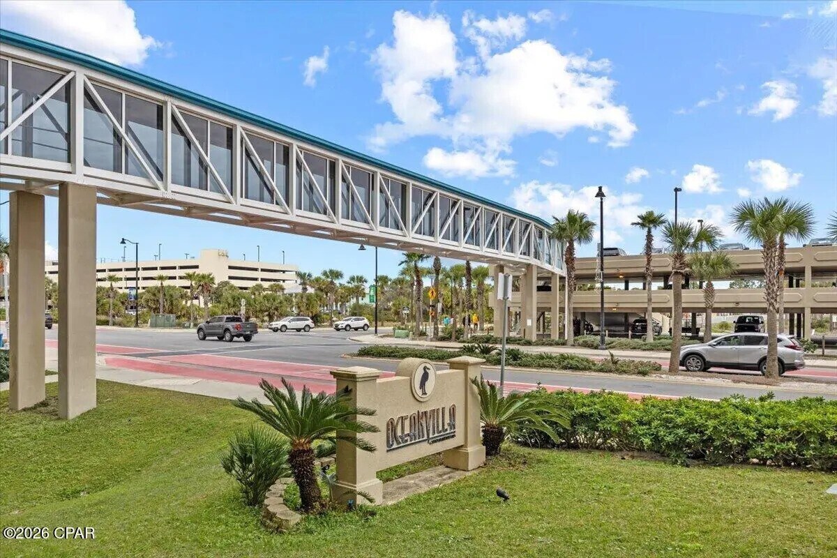 Covered skywalk connecting Ocean Villa with additional parking across the street. (Parking also ava - 10625 Front Beach Rd