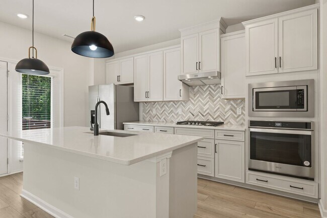 Building Photo - Move-In Ready 4BR Home | Deck, Patio & Open Concept Living