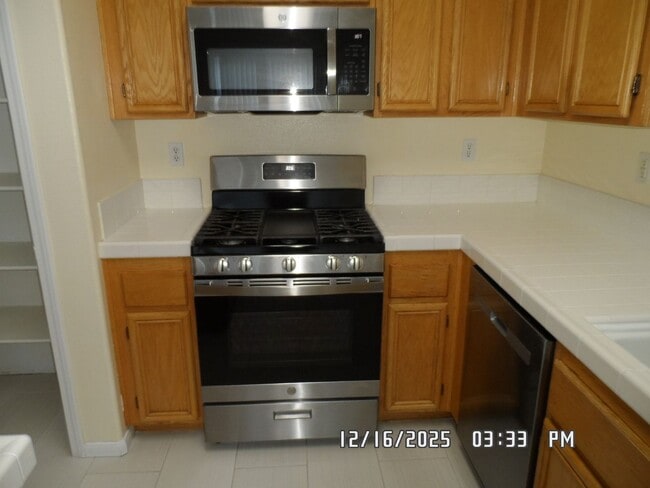 Building Photo - 4 Bedrooms, 2 Bathrooms, 3 Car Garage, 1899 sq. ft., Large Fenced, Front Yard Lawn, Near Schools ...