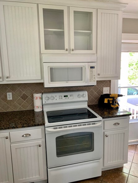Kitchen and covered side door to driveway - 1112 Joyner Ave
